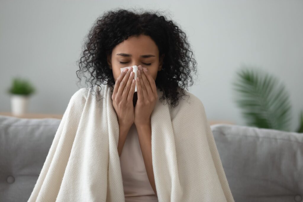 woman blowing nose