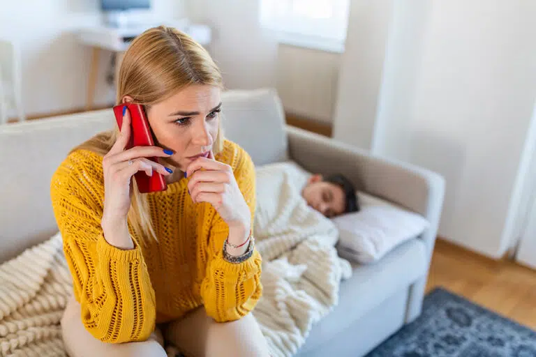 Woman makes worried phone call about sick child